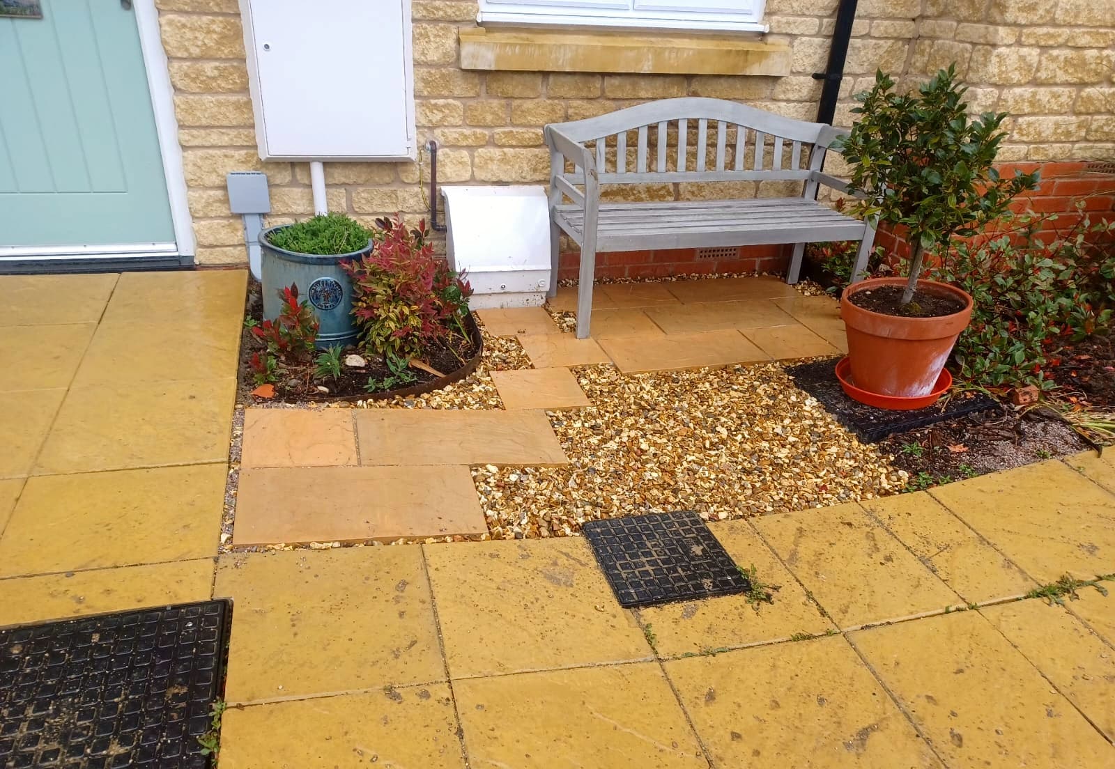 Flagstone paved seating area with timber bench
